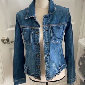 Adorable denim jacket with lots of cute accents.